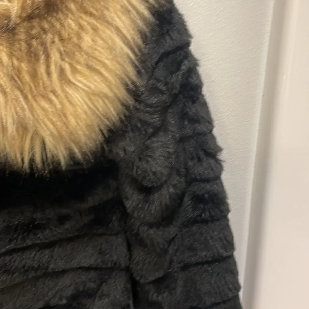 KAPOK Woman’s Black Faux Fur Coat With Faux Brown And Tan Trim Around The Neck
